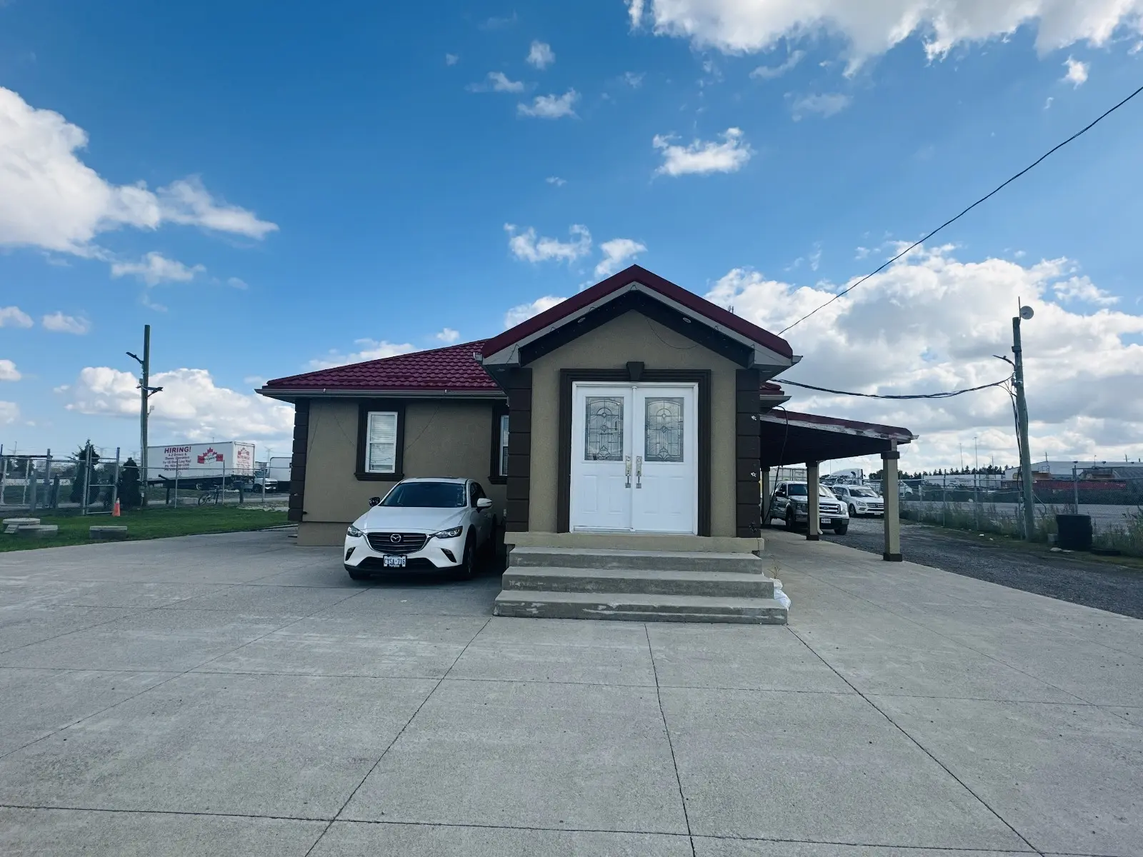 Indo Canadian Carriers headquarters building with red roof in Halton Hills Ontario