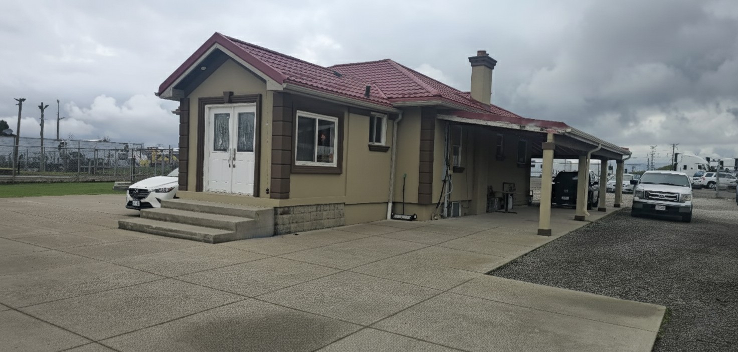 Company facility building with covered parking for fleet vehicles